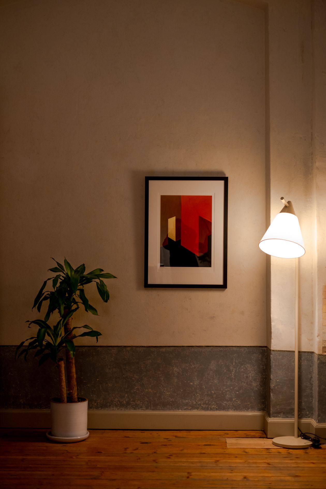Custom wall design with framed wall art and warm lighting